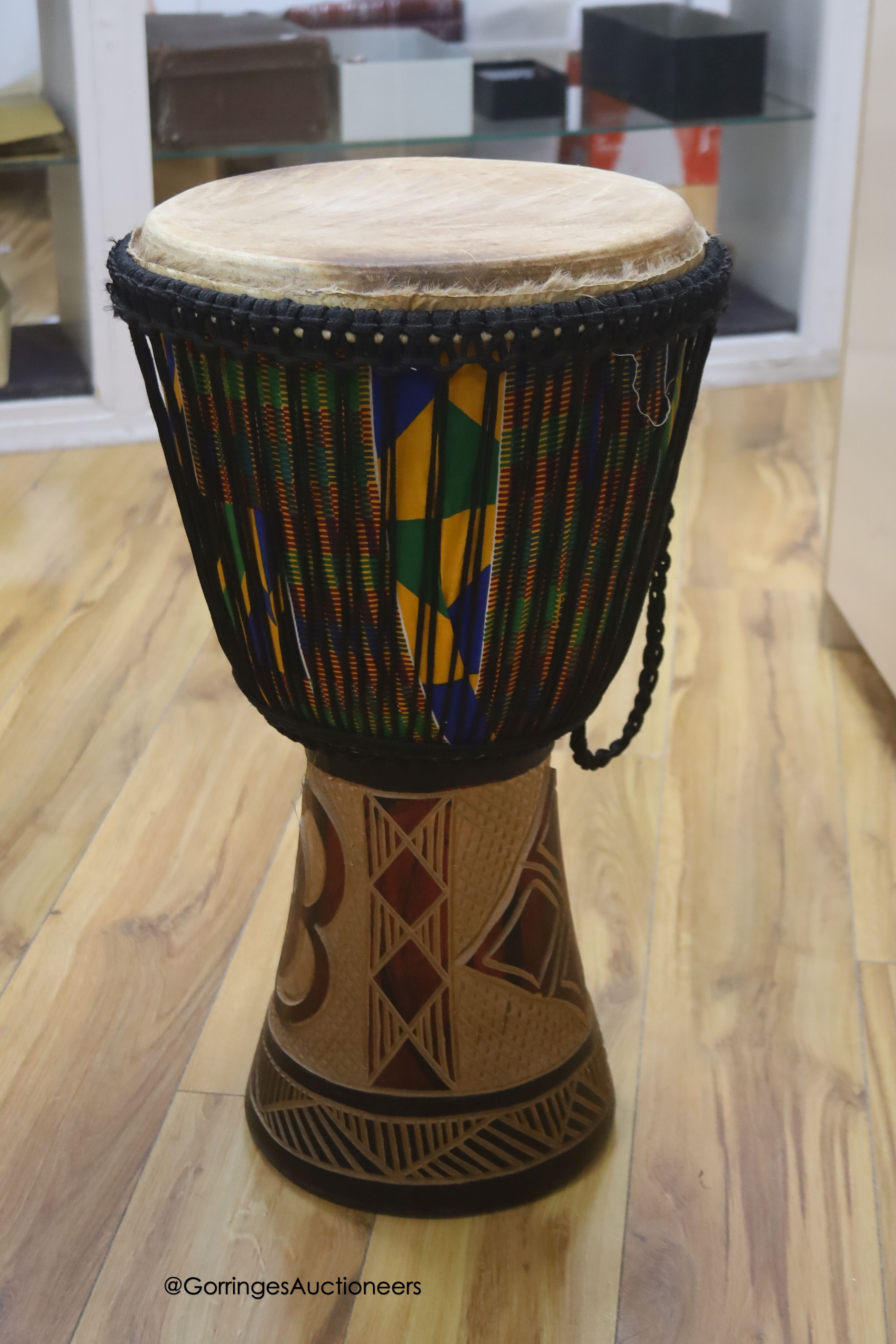 A Ghanian Djembe drum, height 62cm